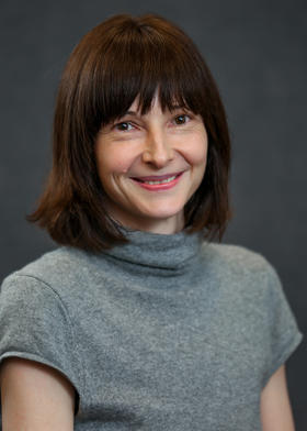 headshot of Nadja Rottner in gray turtleneck