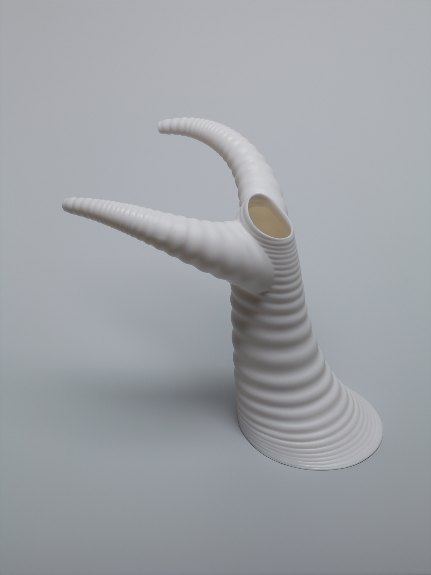 white sculpture with two horns