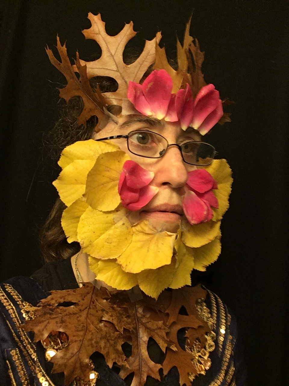 Madeline Schwartzman headshot with leaves and flower petals